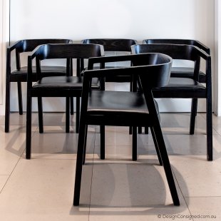 six black timber chairs Bedont Italy