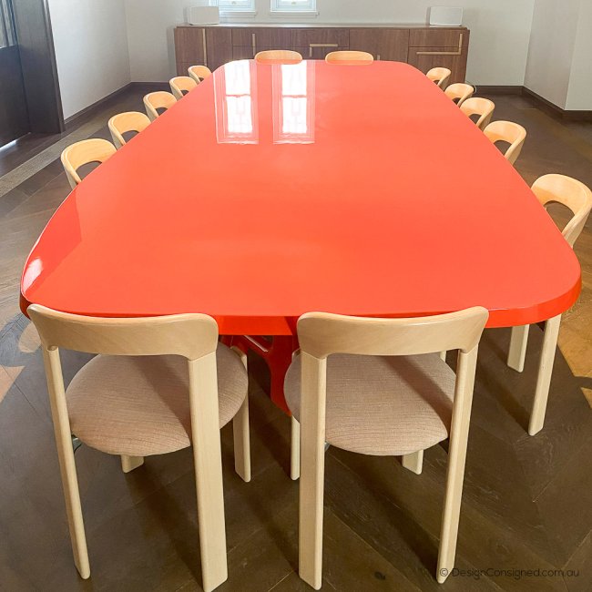 red dining table by Jean Pierre Tortil for Delcourt