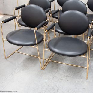 12 brass and black leather dining chairs Baxter